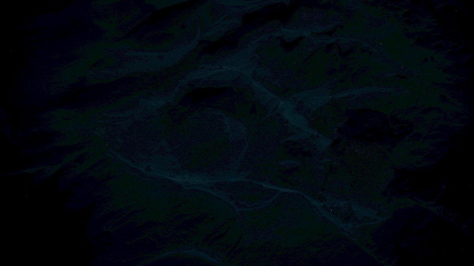 The image appears very dark with indiscernible details and abstract patterns throughout, making it difficult to identify specific elements.